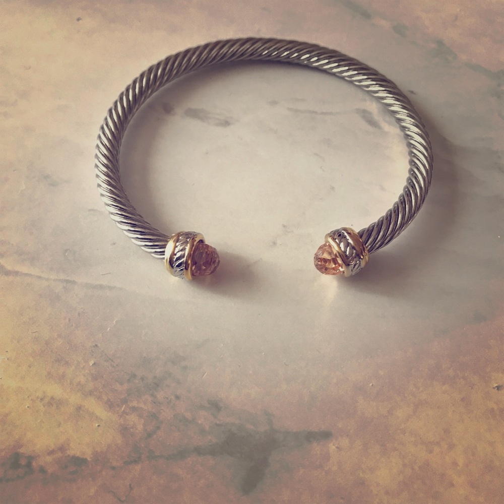 Silver braided bracelet with amber gemstone